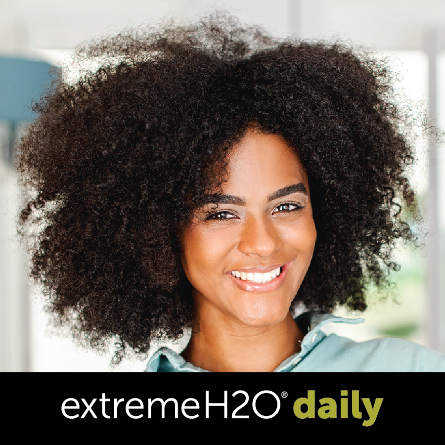 Pretty African American woman wearing Extreme h2O Daily contact lenses